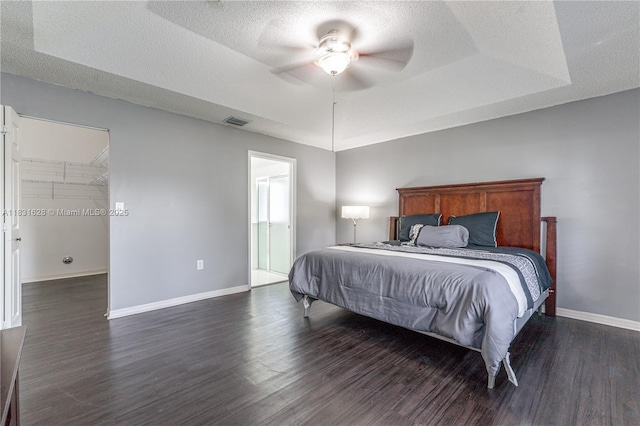 1122 NW 143rd Ave, Pembroke Pines, FL 33028 - bedroom featuring dark wood-style floors, a textured ceiling, ceiling fan, and ensuite bathroom