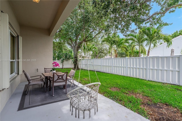 1122 NW 143rd Ave, Pembroke Pines, FL 33028 - fenced backyard with outdoor dining space and a patio area