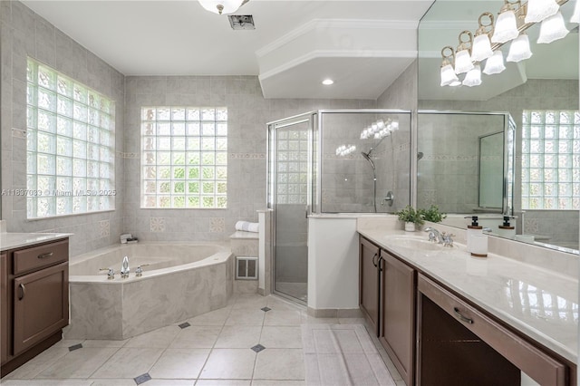 1907 NW 137th Ter, Pembroke Pines, FL 33028 - bathroom with vanity, a bath, tile patterned flooring, a shower stall, and tile walls
