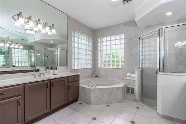 1907 NW 137th Ter, Pembroke Pines, FL 33028 - full bathroom featuring vanity, a garden tub, a shower stall, tile walls, and tile patterned floors