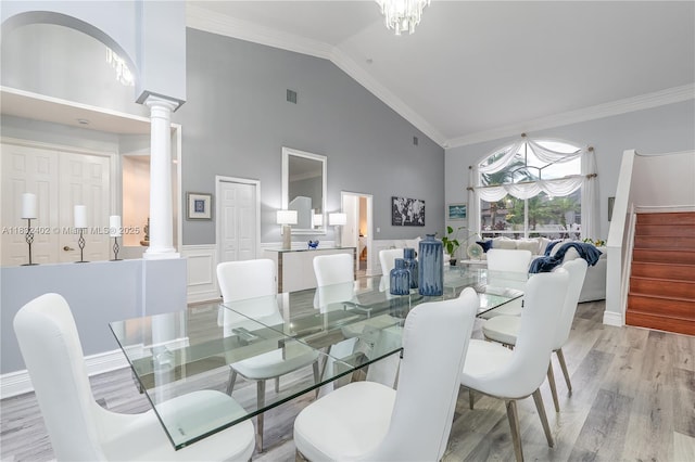 13850 NW 23rd St, Pembroke Pines, FL 33028 - dining area with ornate columns, high vaulted ceiling, light wood-style floors, ornamental molding, and stairway