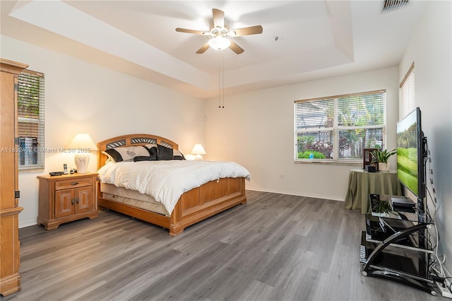 13850 NW 23rd St, Pembroke Pines, FL 33028 - bedroom featuring a raised ceiling, wood finished floors, and ceiling fan