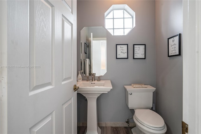 13850 NW 23rd St, Pembroke Pines, FL 33028 - bathroom featuring toilet and wood finished floors