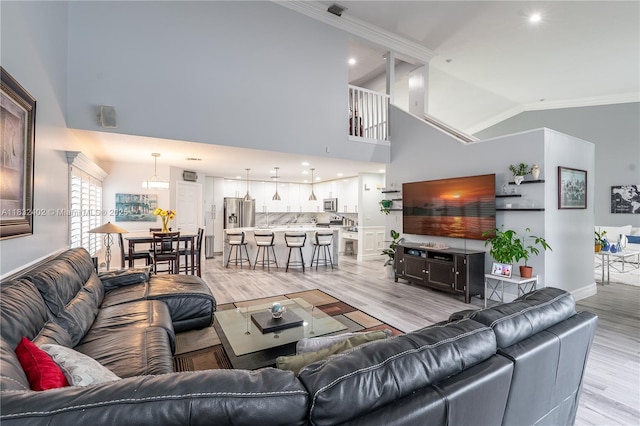 13850 NW 23rd St, Pembroke Pines, FL 33028 - living area featuring light wood-style flooring, ornamental molding, high vaulted ceiling, and recessed lighting