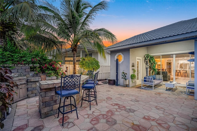 13850 NW 23rd St, Pembroke Pines, FL 33028 - patio terrace at dusk featuring a patio