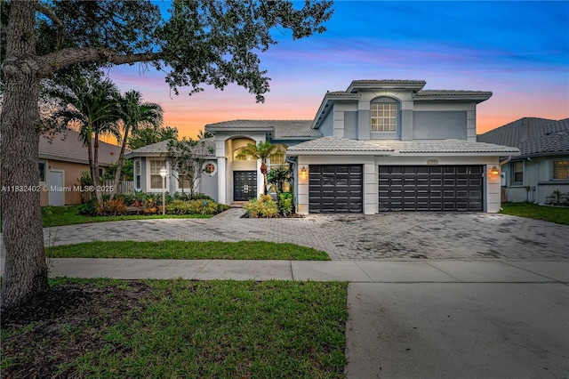 13850 NW 23rd St, Pembroke Pines, FL 33028 - view of front of house with decorative driveway, stucco siding, a tile roof, and a garage