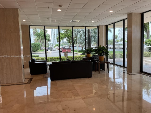 400 Kings Point Dr Unit 623, Sunny Isles Beach, FL 33160 - building lobby with a wall of windows, recessed lighting, and a drop ceiling