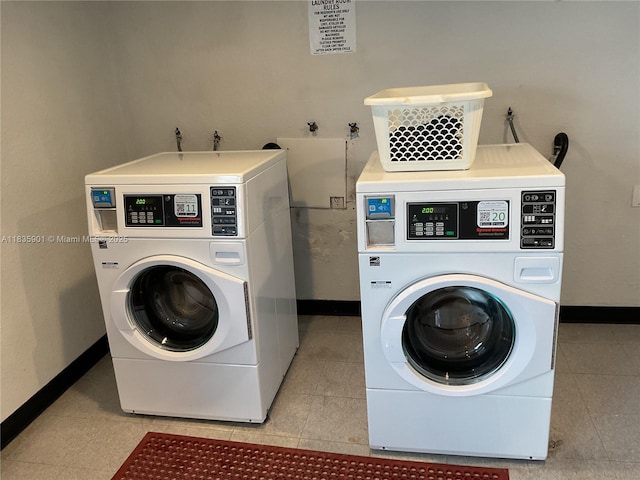 400 Kings Point Dr Unit 623, Sunny Isles Beach, FL 33160 - laundry area with washer and clothes dryer and light tile patterned flooring