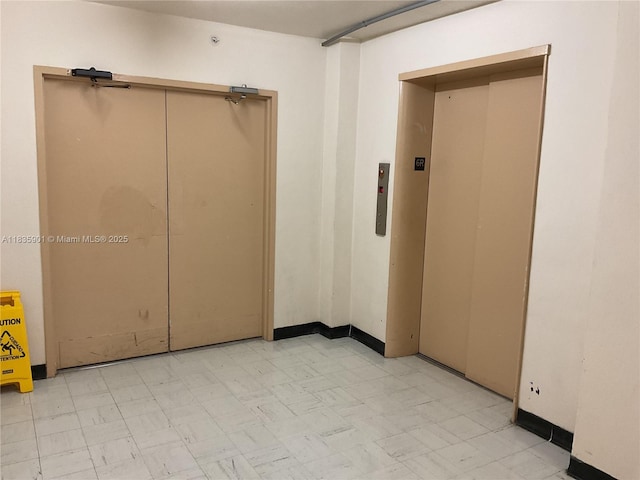 400 Kings Point Dr Unit 623, Sunny Isles Beach, FL 33160 - empty room with light floors and elevator