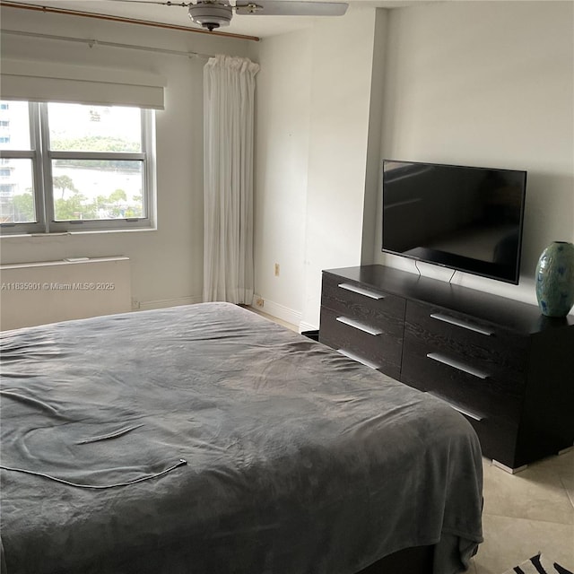 400 Kings Point Dr Unit 623, Sunny Isles Beach, FL 33160 - bedroom featuring light tile patterned flooring and radiator