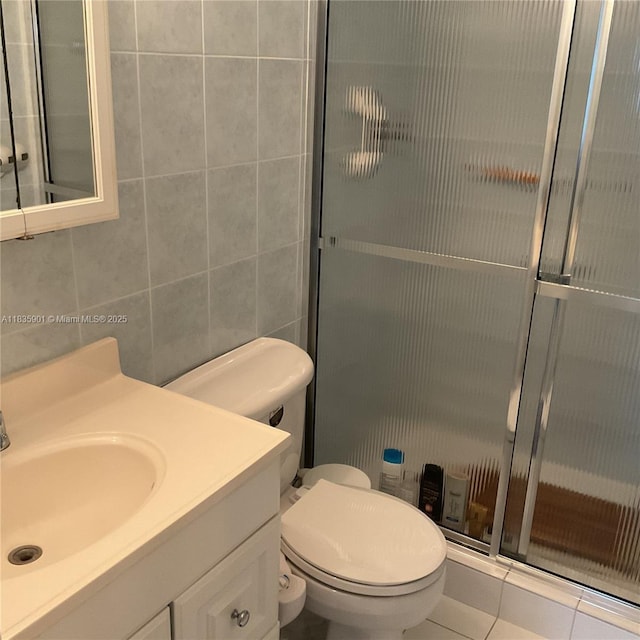 400 Kings Point Dr Unit 623, Sunny Isles Beach, FL 33160 - bathroom featuring vanity, tile walls, and a stall shower