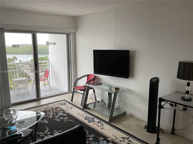 400 Kings Point Dr Unit 623, Sunny Isles Beach, FL 33160 - living area featuring light tile patterned floors and a textured ceiling