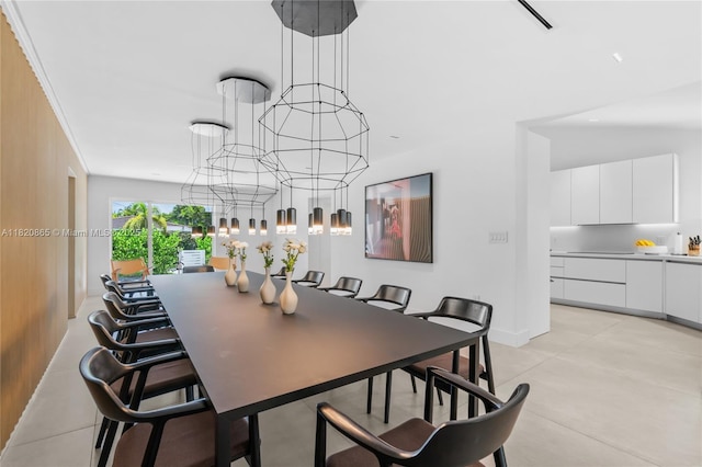 9033 Emerson Ave, Surfside, FL 33154 - dining space with a chandelier and baseboards