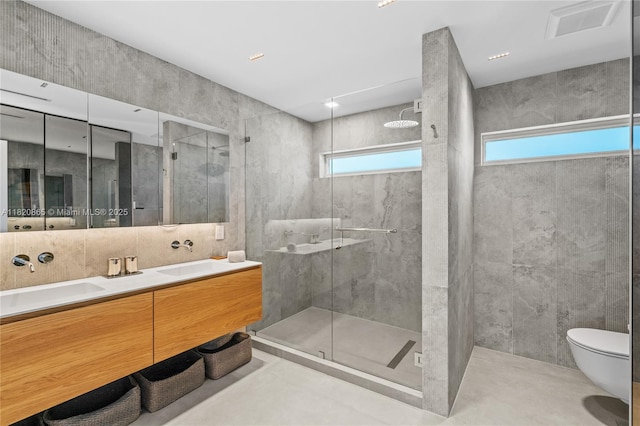 9033 Emerson Ave, Surfside, FL 33154 - bathroom featuring a stall shower, tile walls, and double vanity
