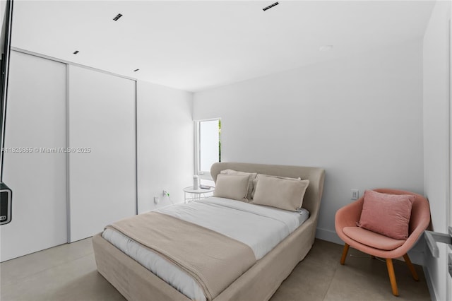 9033 Emerson Ave, Surfside, FL 33154 - bedroom featuring a closet and finished concrete floors