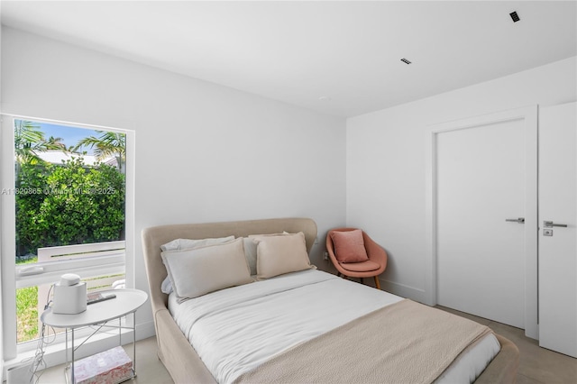 9033 Emerson Ave, Surfside, FL 33154 - bedroom with concrete floors