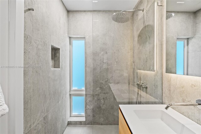 9033 Emerson Ave, Surfside, FL 33154 - full bath with tiled shower, vanity, plenty of natural light, tile walls, and tile patterned flooring