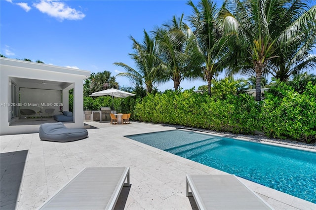 9033 Emerson Ave, Surfside, FL 33154 - view of swimming pool featuring a patio area and an outdoor kitchen