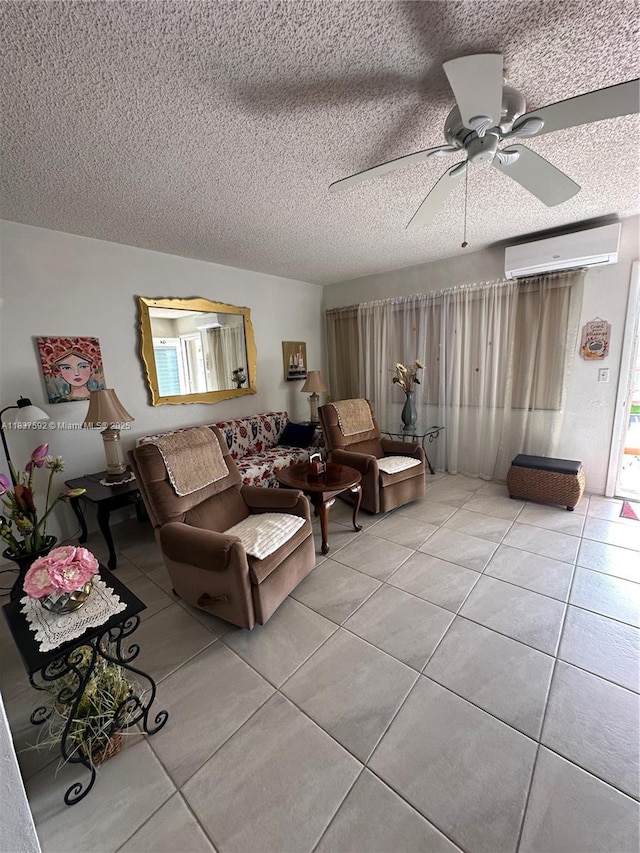 920 SW 11th Ave Unit 12A, Hallandale Beach, FL 33009 - living room featuring a wall unit AC, light tile patterned floors, ceiling fan, and a textured ceiling