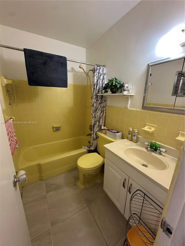 920 SW 11th Ave Unit 12A, Hallandale Beach, FL 33009 - bathroom featuring shower / bath combo with shower curtain, tile patterned flooring, and vanity