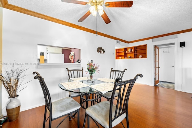 20145 NE 3rd Ct Unit 2, Miami, FL 33179 - dining area with a textured ceiling, ceiling fan, wood finished floors, and crown molding