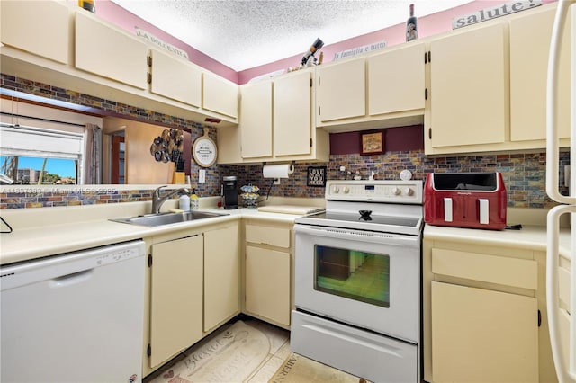 20145 NE 3rd Ct Unit 2, Miami, FL 33179 - kitchen featuring white appliances, backsplash, cream cabinets, light countertops, and a textured ceiling