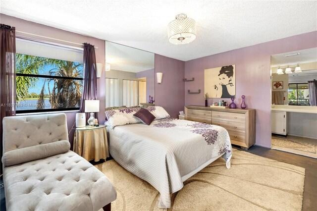 20145 NE 3rd Ct Unit 2, Miami, FL 33179 - bedroom featuring a textured ceiling