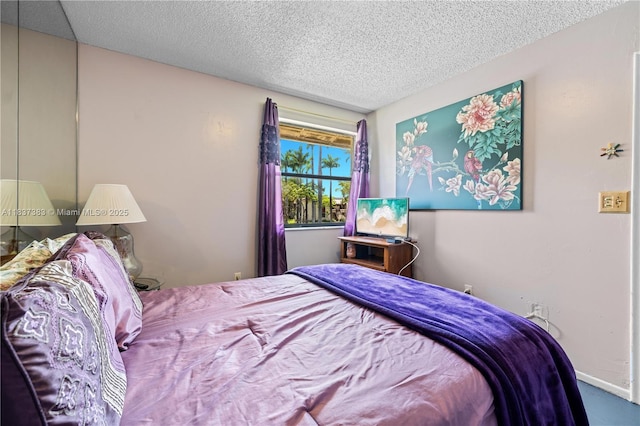 20145 NE 3rd Ct Unit 2, Miami, FL 33179 - bedroom with a textured ceiling and carpet floors