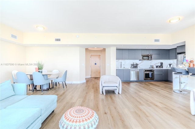 244 Biscayne Blvd Unit 4803, Miami, FL 33132 - living area featuring light wood finished floors and baseboards