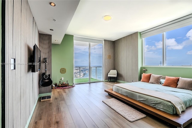 244 Biscayne Blvd Unit 4803, Miami, FL 33132 - bedroom with access to outside and wood finished floors