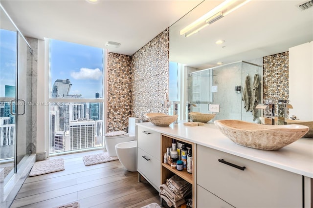 244 Biscayne Blvd Unit 4803, Miami, FL 33132 - full bath featuring a bidet, vanity, a stall shower, and wood finished floors
