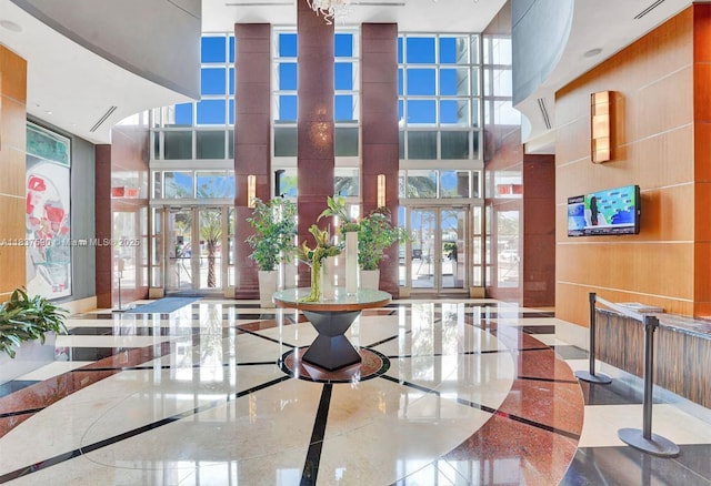 244 Biscayne Blvd Unit 4803, Miami, FL 33132 - common area featuring a towering ceiling and a wall of windows