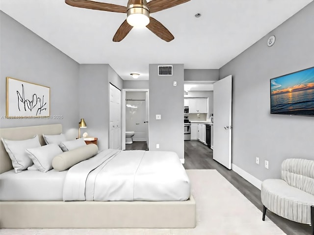2071 Renaissance Blvd Unit 303, Miramar, FL 33025 - bedroom featuring dark wood finished floors and ensuite bath