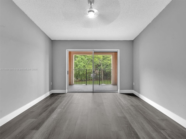 2071 Renaissance Blvd Unit 303, Miramar, FL 33025 - spare room with wood finished floors and a textured ceiling
