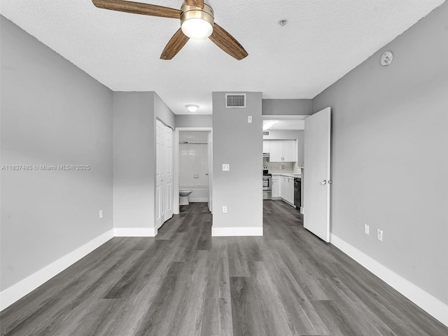 2071 Renaissance Blvd Unit 303, Miramar, FL 33025 - unfurnished living room featuring ceiling fan, dark wood-style floors, and a textured ceiling