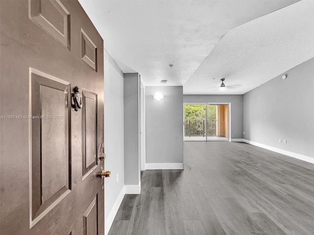 2071 Renaissance Blvd Unit 303, Miramar, FL 33025 - spare room with ceiling fan and wood finished floors
