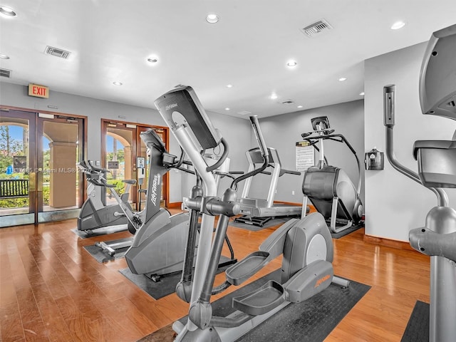 2071 Renaissance Blvd Unit 303, Miramar, FL 33025 - exercise room featuring french doors, wood finished floors, and recessed lighting
