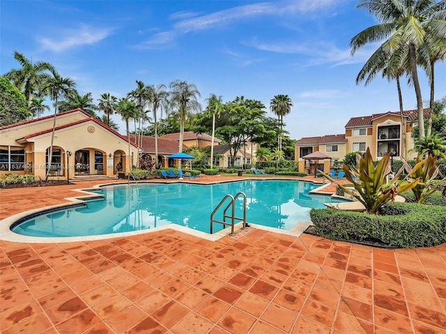 2071 Renaissance Blvd Unit 303, Miramar, FL 33025 - community pool featuring a patio area