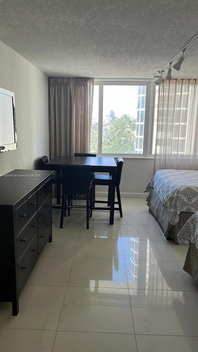 19201 Collins Ave Unit 330, Sunny Isles Beach, FL 33160 - bedroom with light tile patterned floors and a textured ceiling