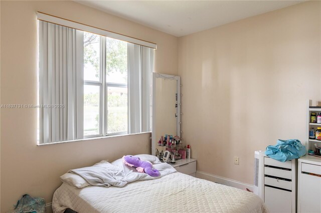 4704 SW 160th Ave Unit 216, Miramar, FL 33027 - bedroom featuring multiple windows