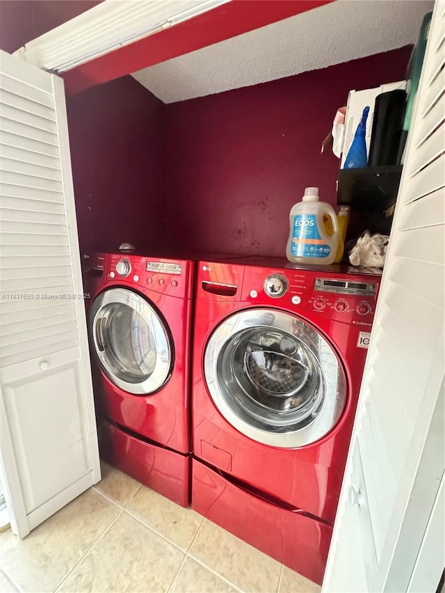 9986 Royal Palm Blvd Unit 9986, Coral Springs, FL 33065 - laundry room featuring separate washer and dryer, tile patterned floors, and a textured ceiling