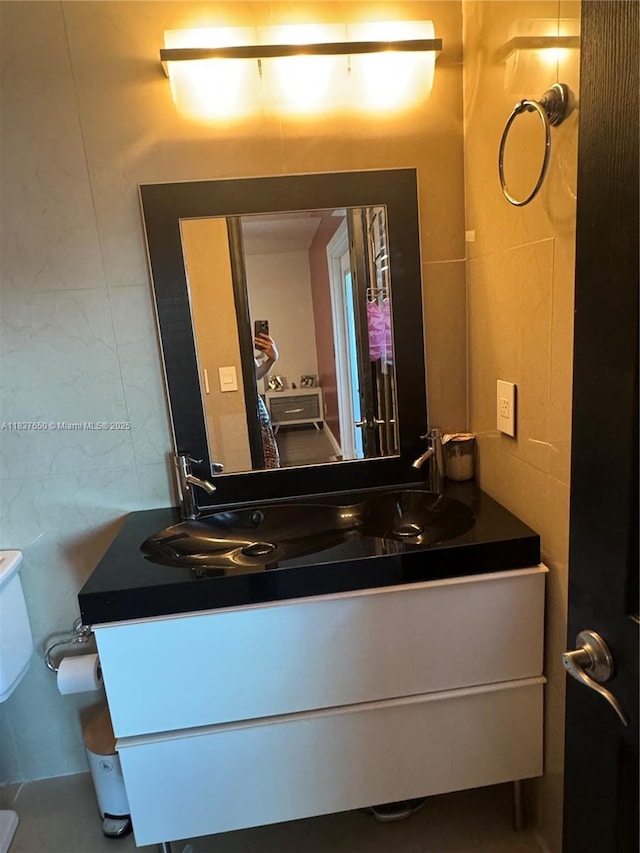 9986 Royal Palm Blvd Unit 9986, Coral Springs, FL 33065 - bathroom with vanity and tile walls