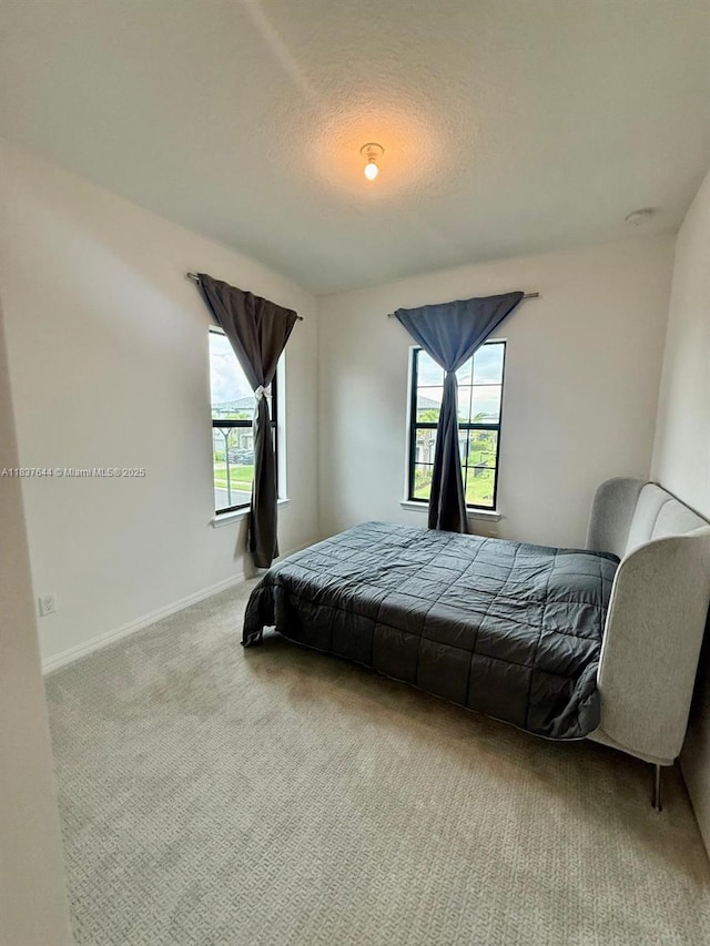 4468 Spruce Ln, Oakland Park, FL 33309 - bedroom featuring carpet and a textured ceiling