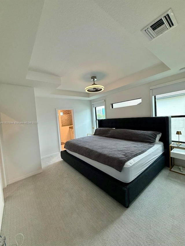 4468 Spruce Ln, Oakland Park, FL 33309 - carpeted bedroom with a tray ceiling