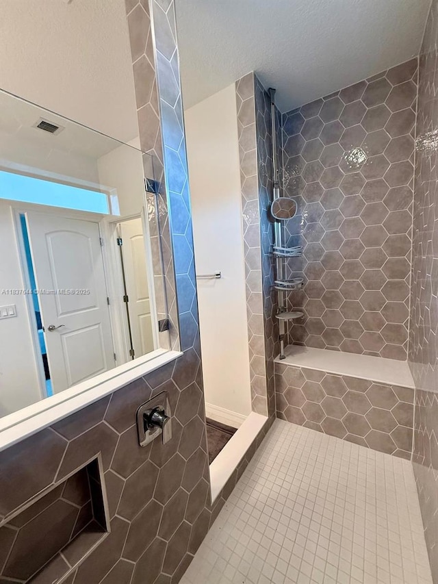 4468 Spruce Ln, Oakland Park, FL 33309 - bathroom featuring a tile shower and tile patterned flooring