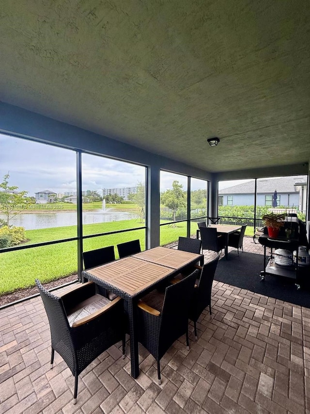 4468 Spruce Ln, Oakland Park, FL 33309 - sunroom / solarium with outdoor dining space and a water view