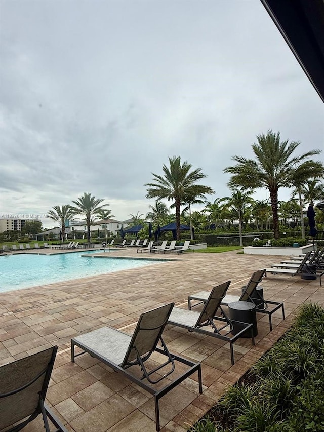 4468 Spruce Ln, Oakland Park, FL 33309 - community pool featuring a patio
