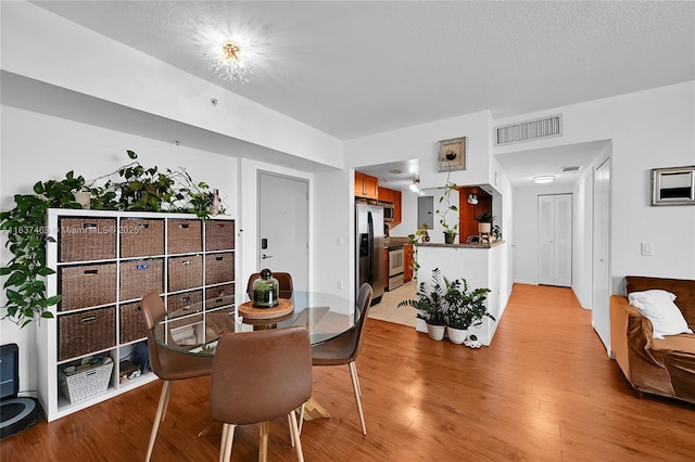 36 NW 6th Ave Unit 701, Miami, FL 33128 - dining space featuring light wood finished floors