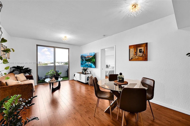 36 NW 6th Ave Unit 701, Miami, FL 33128 - dining space with wood finished floors and baseboards