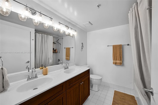 36 NW 6th Ave Unit 701, Miami, FL 33128 - bathroom with double vanity, tile patterned floors, and shower / bath combo